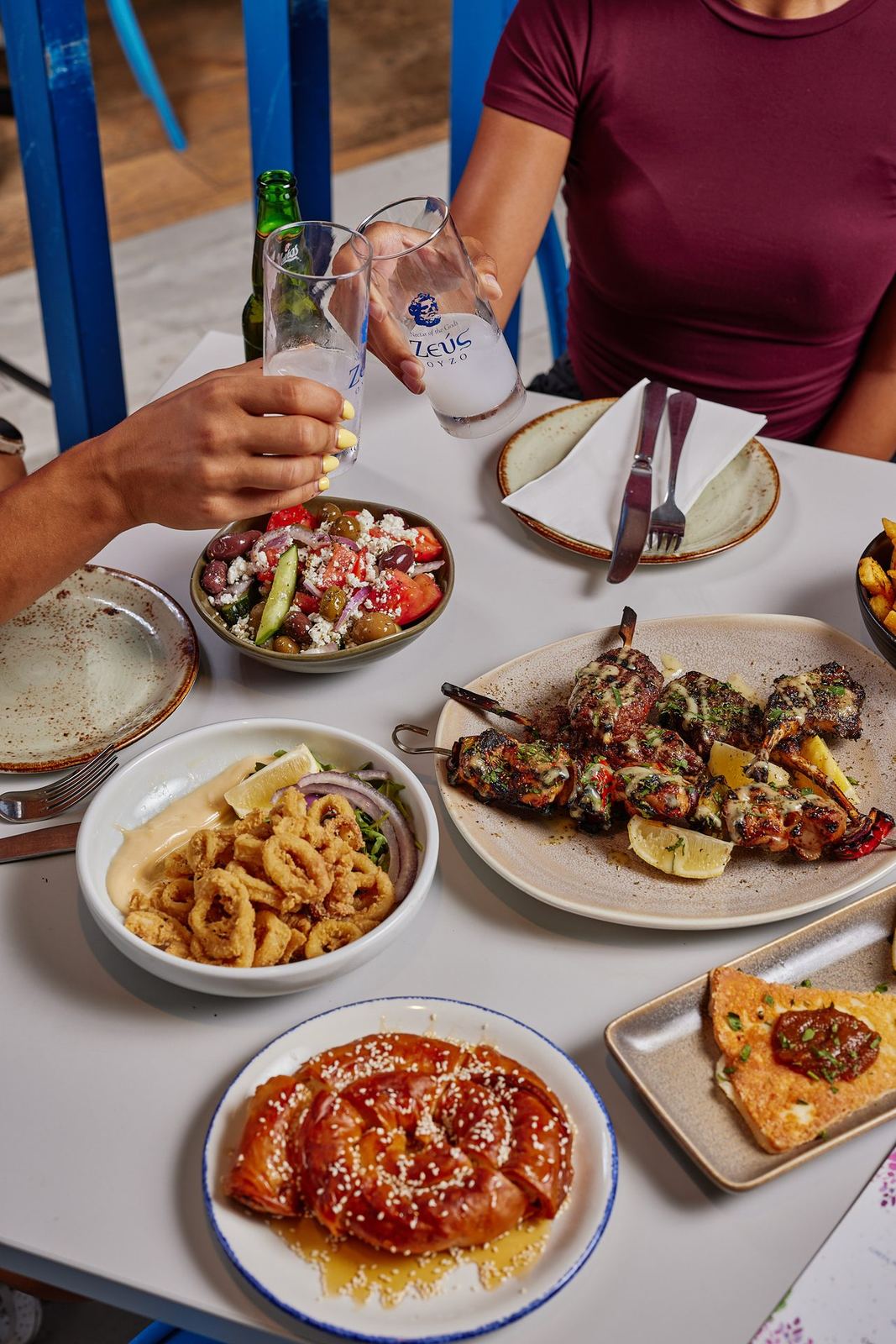 Meze spread - dips, calamari, Greek salad