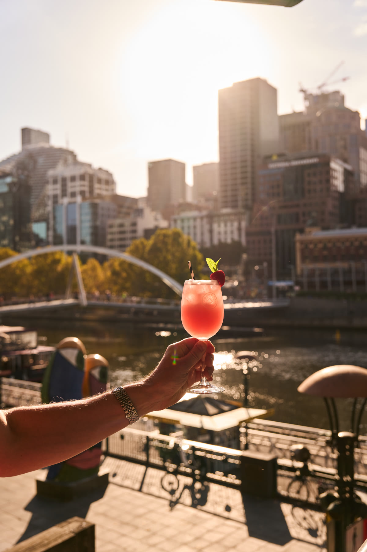 Cocktail at Yassas Southbank with Melbourne skyline
